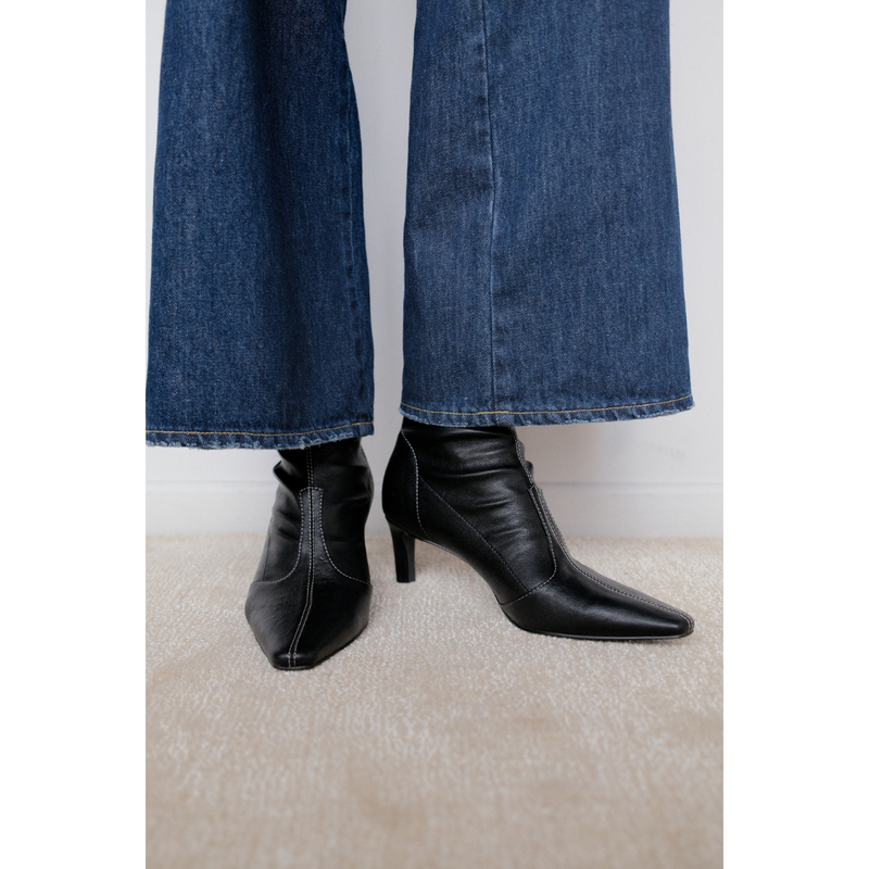 Clara Vegan Heeled Boot – Coconuts by Matisse – Black faux leather boot with pointed toe, mid-calf shaft, and slim heel.