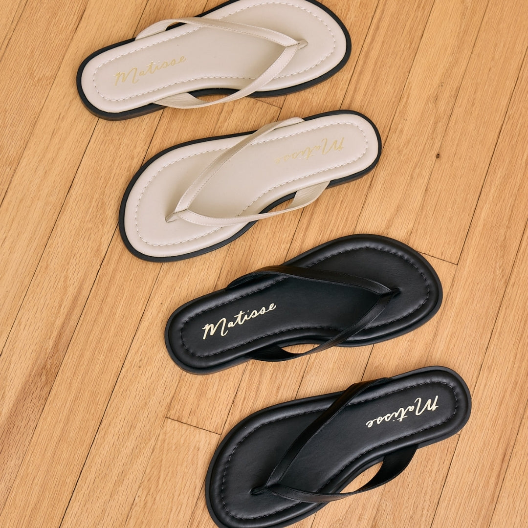 Leo Flip Flop Sandal – Matisse Footwear – Leather flip flop sandals with cushioned footbed, wide thong strap, and sleek black sole. A laid-back yet refined essential for casual summer comfort.