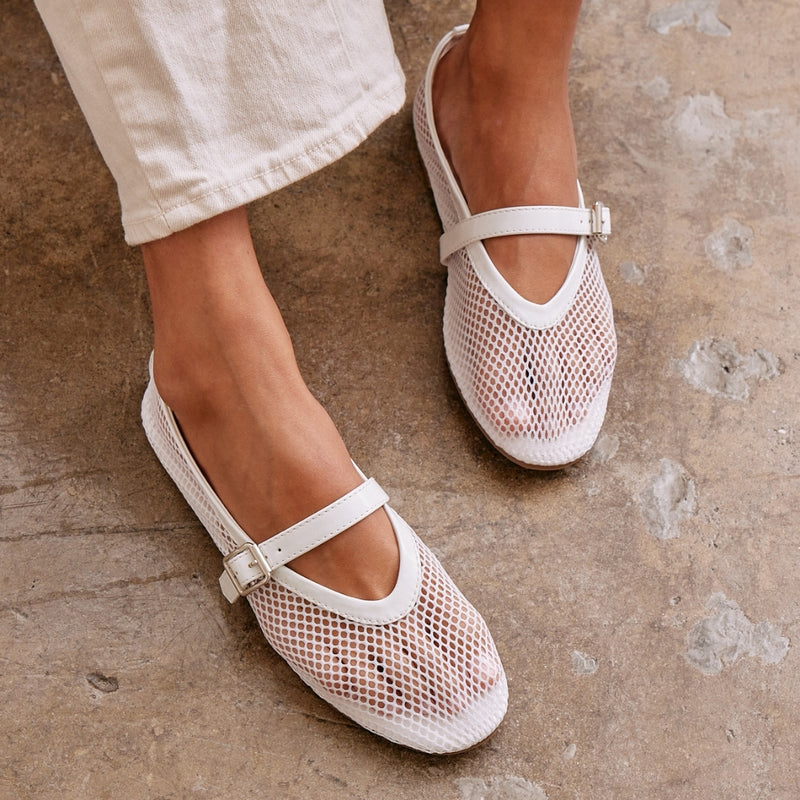 Nolita Ballet Flat – Coconuts By Matisse – White mesh ballet flats with a glossy faux leather trim, pointed toe, and adjustable Mary Jane strap. A sleek and modern interpretation of a classic staple.