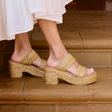 Ocean Ave Platform Sandal – Beach By Matisse – Tan raffia platform sandals with a chunky heel, dual foot straps, and cushioned insole. A beach-to-brunch essential blending texture, height, and easy elegance.
