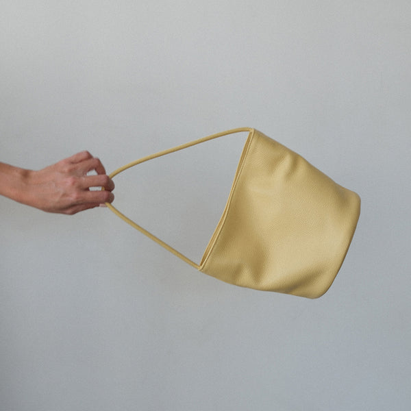 Vancouver Bucket Bag - Matisse - Footwear - Minimalist bucket bag in butter yellow leather with a seamless silhouette and a single shoulder strap. A versatile and unstructured carryall with effortless, elevated appeal.