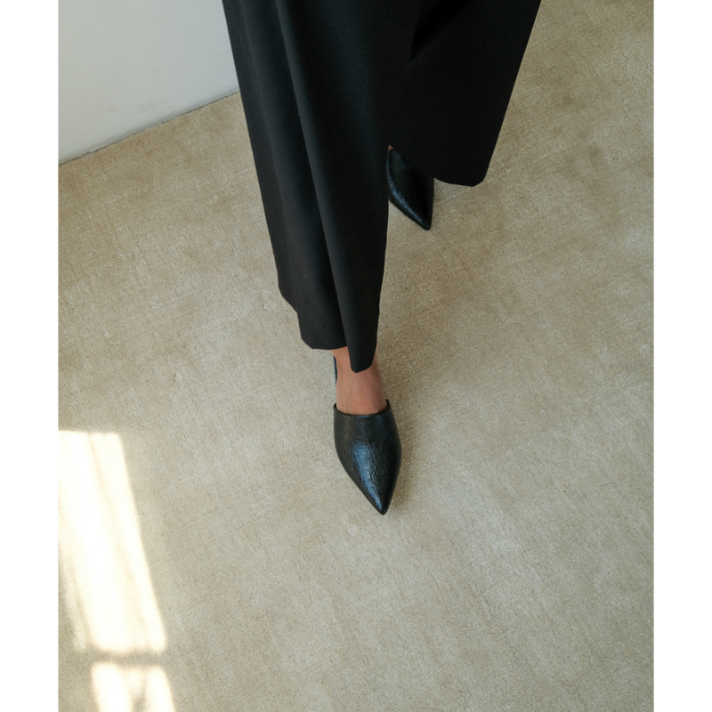 Garret Heeled Mule – Beach by Matisse – Black pointed-toe slip-on mule with textured finish and stiletto heel.