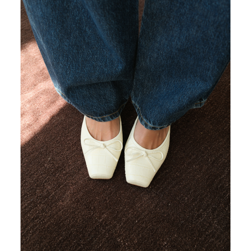Geneva Heeled Mule – Coconuts by Matisse – Ivory croc-embossed mule with a square toe, low block heel, and delicate bow detail.