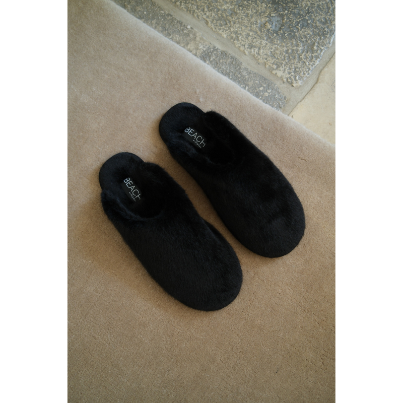 Lounge Vegan Slipper – Beach by Matisse – Black faux fur closed-toe slipper with flat sole and cozy silhouette.