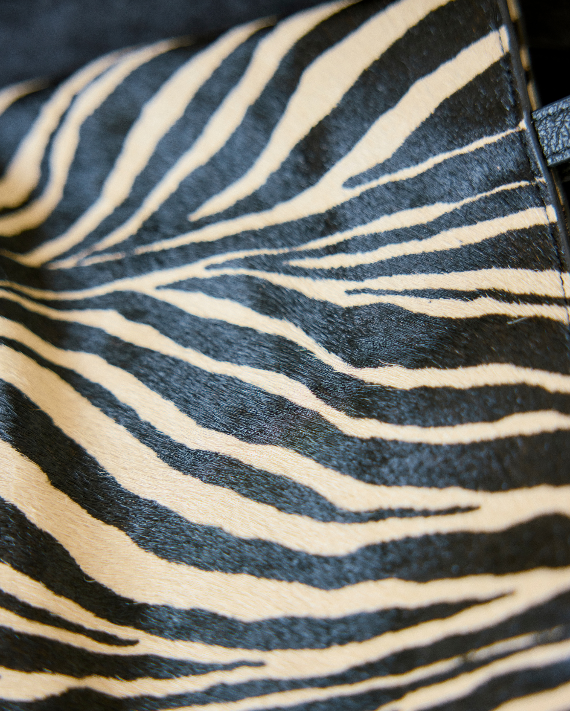 close up of brown and black zebra print tote bag