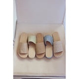 Set of five espadrille sandals with 'Beach by Matisse' branding on a beige cushion.