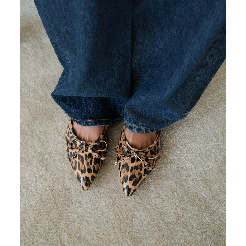 Reggie Vegan Pointed Toe Mule – Beach by Matisse – Faux patent leather leopard print flat mule with pointed toe and petite bow detail.