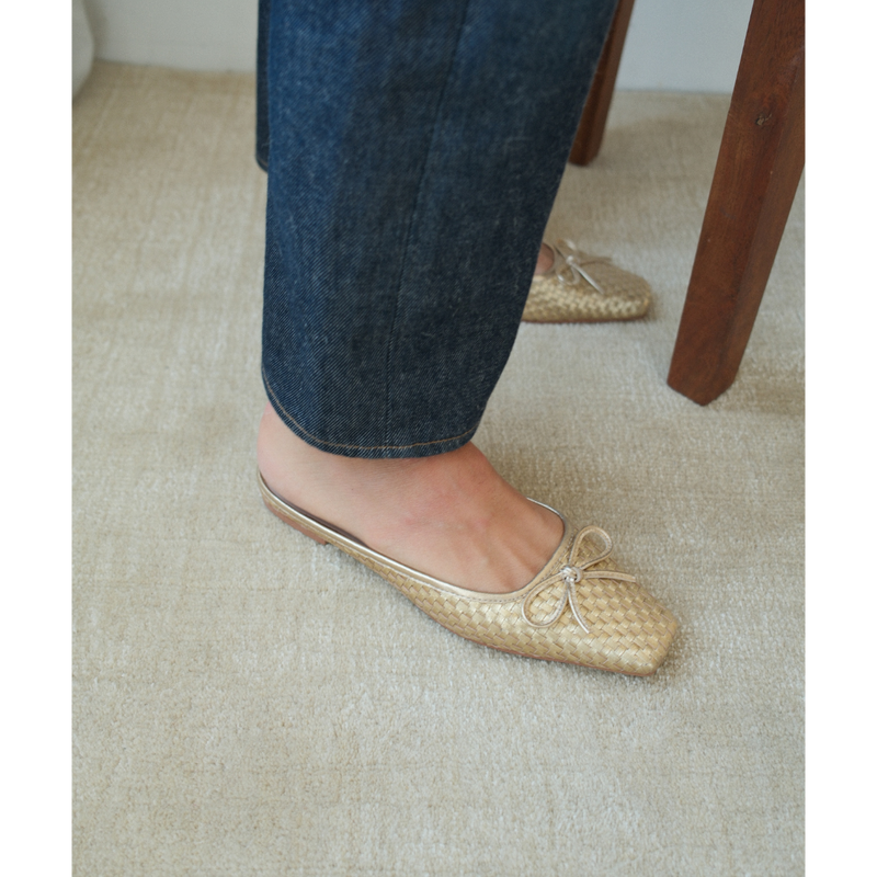 Remy Ballet Mule – Matisse – Woven metallic gold leather flat mule with square toe and bow detail.