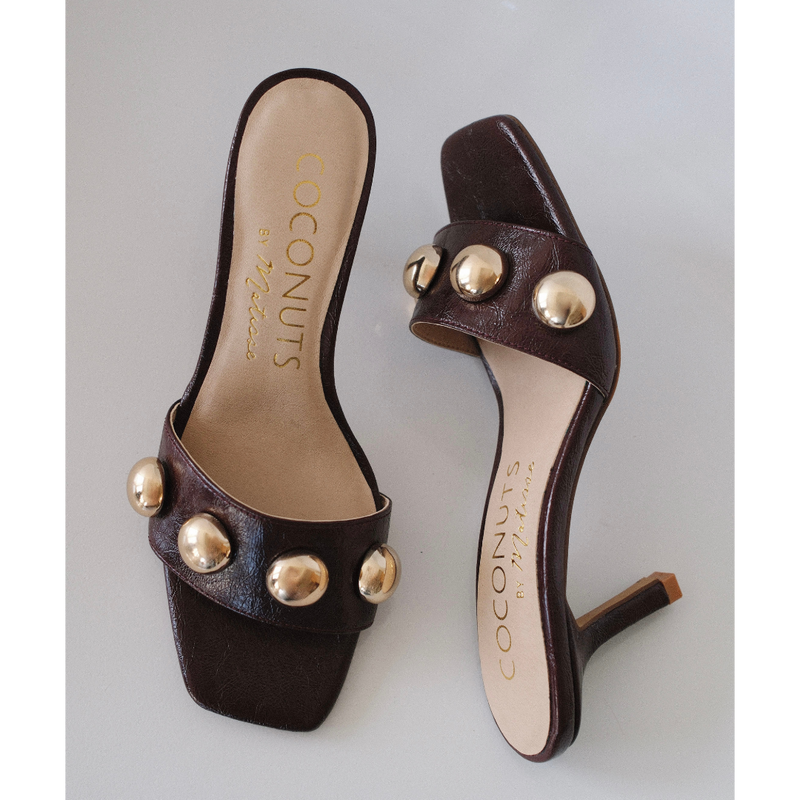 Theo Heeled Sandal – Coconuts by Matisse – Burgundy slip-on sandal with square toe, gold dome embellishments, and tapered heel.