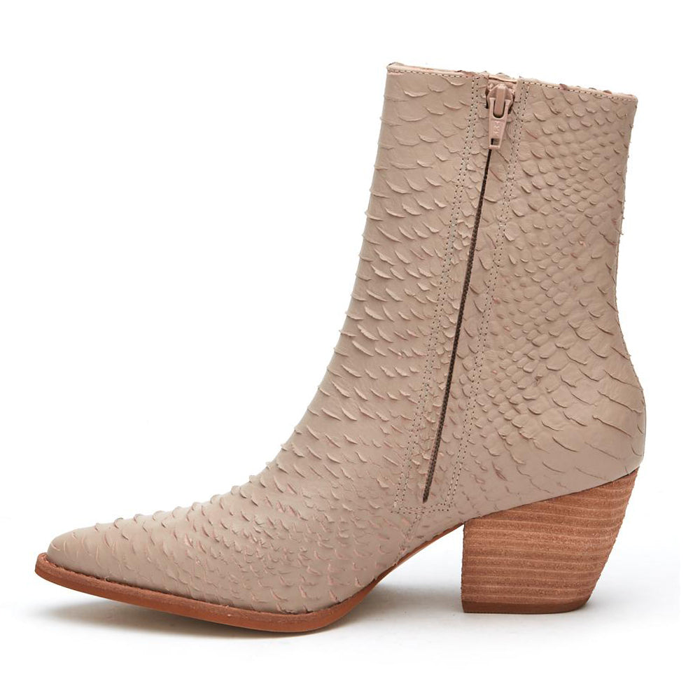 A refined take on western-inspired style, these beige ankle boots feature a pointed toe, textured finish, and stacked block heel. Versatile and effortlessly chic.