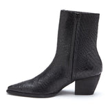 A bold statement piece, these black ankle boots feature a textured finish, pointed toe, and stacked block heel. Designed for effortless edge and all-day wear.