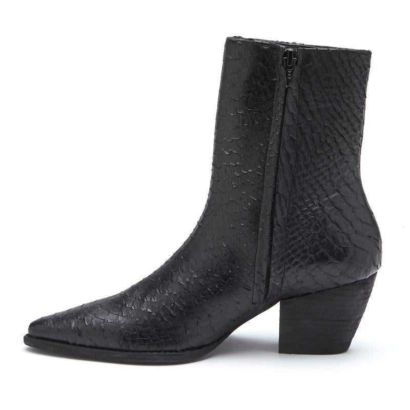 A bold statement piece, these black ankle boots feature a textured finish, pointed toe, and stacked block heel. Designed for effortless edge and all-day wear.