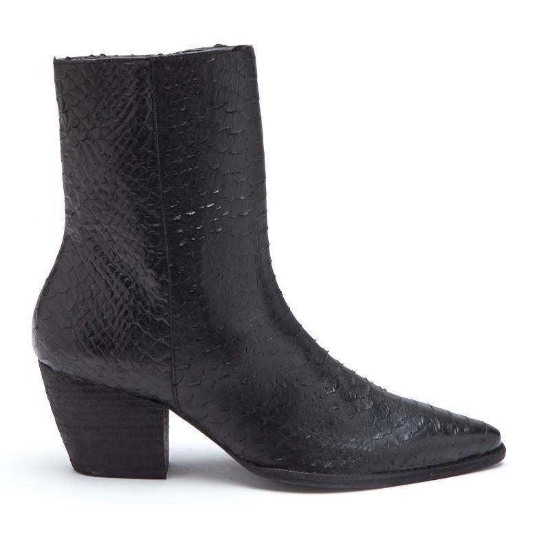 A bold statement piece, these black ankle boots feature a textured finish, pointed toe, and stacked block heel. Designed for effortless edge and all-day wear.