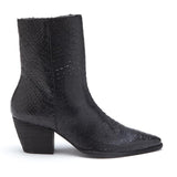 A bold statement piece, these black ankle boots feature a textured finish, pointed toe, and stacked block heel. Designed for effortless edge and all-day wear.
